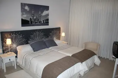 Cama o camas de una habitación en Hotel Cuatro Calzadas