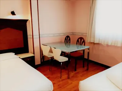 Cama o camas de una habitación en Hosteria Sara by gaiarooms