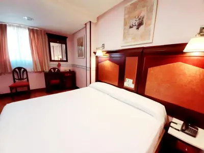 Cama o camas de una habitación en Hosteria Sara by gaiarooms