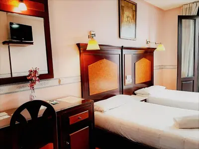 Cama o camas de una habitación en Hosteria Sara by gaiarooms