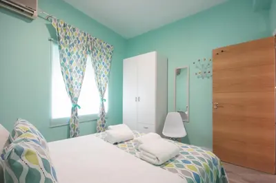Cama o camas de una habitación en Apartamentos Coso de San Albin