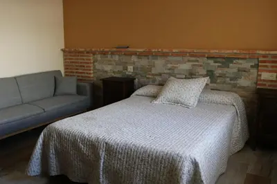Cama o camas de una habitación en Casa Rural 