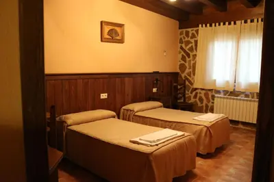 Cama o camas de una habitación en Casa Rural 
