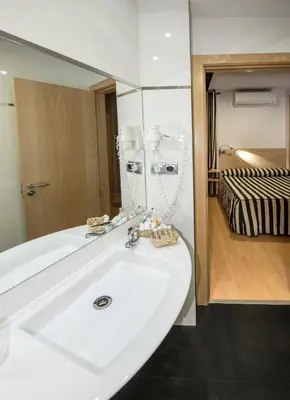 Cama o camas de una habitación en Hotel Puerta de la Santa