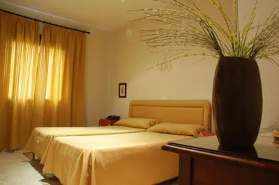 Cama o camas de una habitación en Hostal León