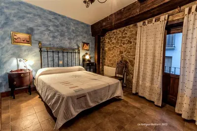 Cama o camas de una habitación en La Antigua Botica