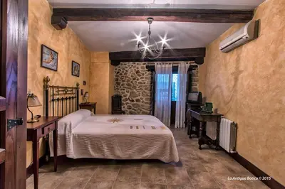 Cama o camas de una habitación en La Antigua Botica