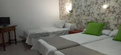 Cama o camas de una habitación en Rincón Extremeño