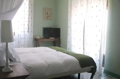 Cama o camas de una habitación en Hotel Villa Maria
