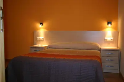 Cama o camas de una habitación en Hostal Hispanico I