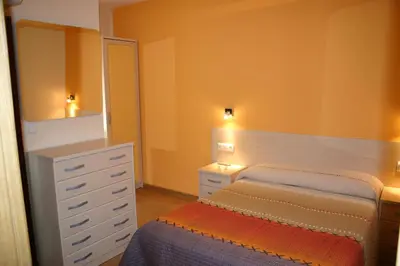 Cama o camas de una habitación en Hostal Hispanico I