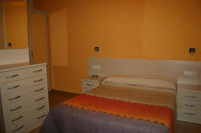Cama o camas de una habitación en Hostal Hispanico I
