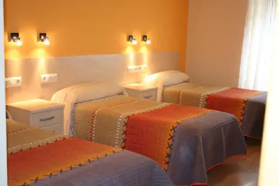 Cama o camas de una habitación en Hostal Hispanico I