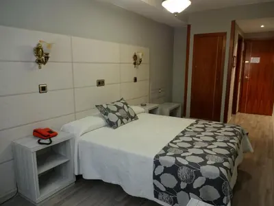 Cama o camas de una habitación en Hotel Los Naranjos