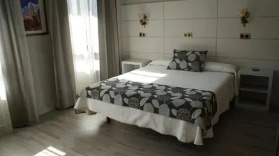 Cama o camas de una habitación en Hotel Los Naranjos