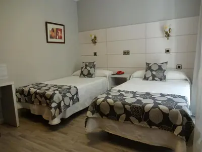Cama o camas de una habitación en Hotel Los Naranjos