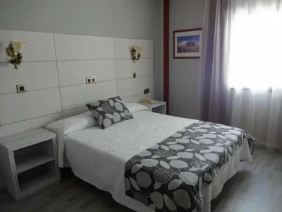 Cama o camas de una habitación en Hotel Los Naranjos