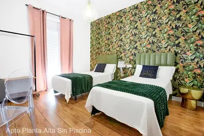 Cama o camas de una habitación en Apartamentos Durán Pizarro 1930