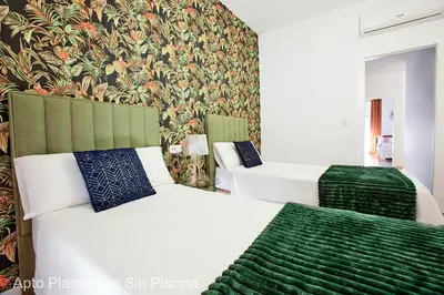 Cama o camas de una habitación en Apartamentos Durán Pizarro 1930