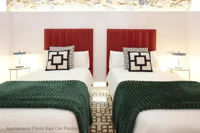 Cama o camas de una habitación en Apartamentos Durán Pizarro 1930