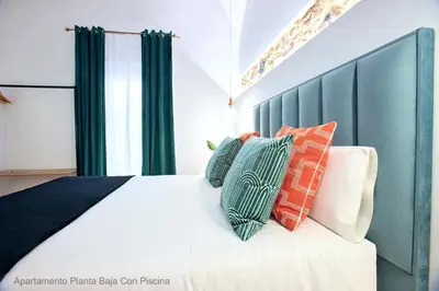 Cama o camas de una habitación en Apartamentos Durán Pizarro 1930