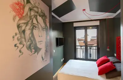 Cama o camas de una habitación en Apartamentos Ele San Justo Plaza