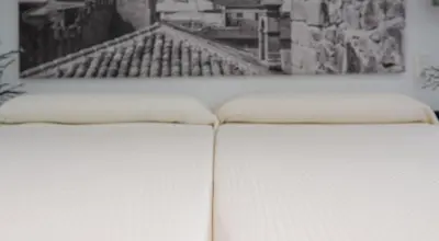 Cama o camas de una habitación en Apartamentos Turísticos Domus Seleqtia Plaza Mayor