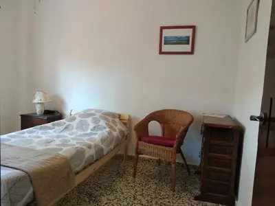 Cama o camas de una habitación en La Tierra Verde COTTAGE