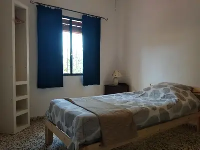 Cama o camas de una habitación en La Tierra Verde COTTAGE