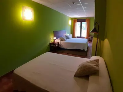 Cama o camas de una habitación en Hotel Rural Los Molinillos