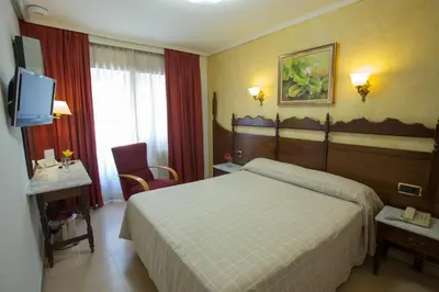 Cama o camas de una habitación en Hotel Reyes Catolicos