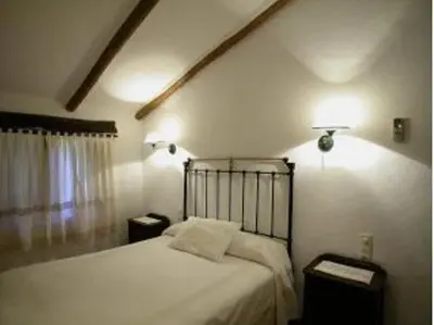 Cama o camas de una habitación en Puerto Roque Turismo Rural