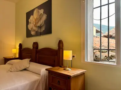 Cama o camas de una habitación en Hostal El Rincon de la Vera
