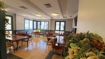 Zona de estar de Hostal La Palmera