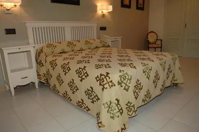 Cama o camas de una habitación en Hostal La Palmera