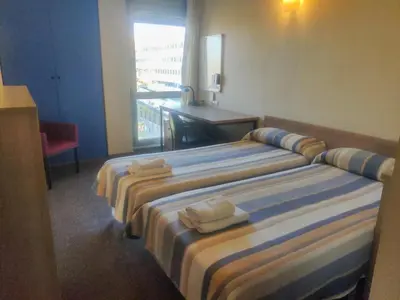 Cama o camas de una habitación en Residencia Universitaria Resa Hernan Cortes