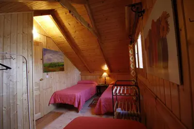 Cama o camas de una habitación en El Paso de las Cigüeñas