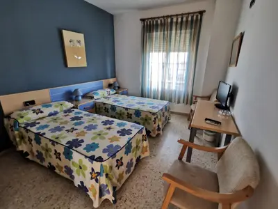 Cama o camas de una habitación en Hostal Talavera