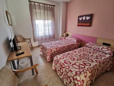 Cama o camas de una habitación en Hostal Talavera