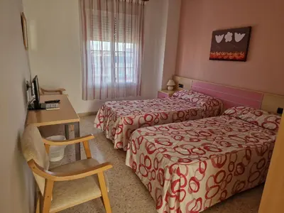 Cama o camas de una habitación en Hostal Talavera