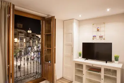 Una televisión o centro de entretenimiento en Apartamentos Boutique Salamanca