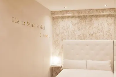 Cama o camas de una habitación en Apartamentos Boutique Salamanca