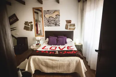 Cama o camas de una habitación en Junior Suites con Jacuzzi