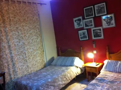 Cama o camas de una habitación en Hostal Neptuno