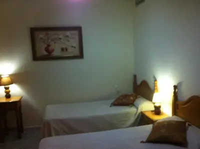 Cama o camas de una habitación en Hostal Neptuno