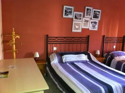 Cama o camas de una habitación en Hostal Neptuno