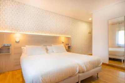 Cama o camas de una habitación en Hostal Gran Duque