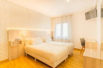 Cama o camas de una habitación en Hostal Gran Duque