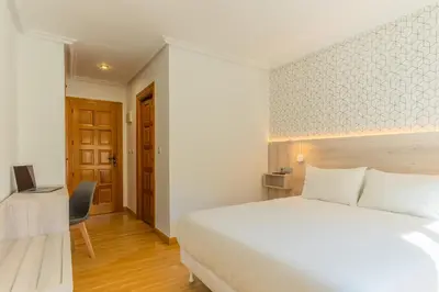 Cama o camas de una habitación en Hostal Gran Duque
