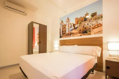 Cama o camas de una habitación en Baluart Apartments